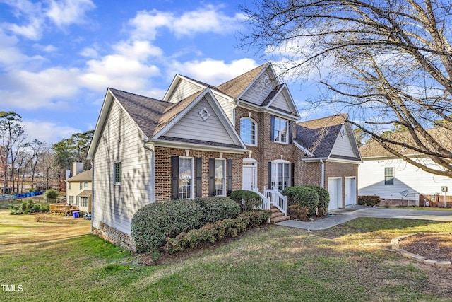 view of front of property featuring a garage and a front yard