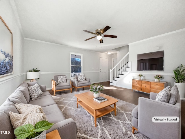 living room with ceiling fan, wood-type flooring, and ornamental molding