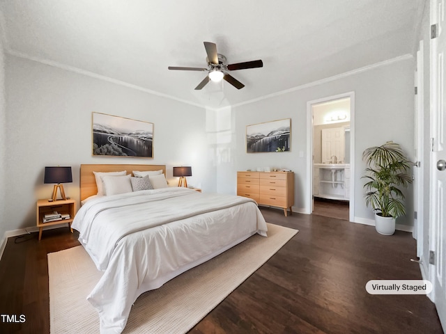 bedroom featuring dark hardwood / wood-style flooring, connected bathroom, crown molding, and ceiling fan