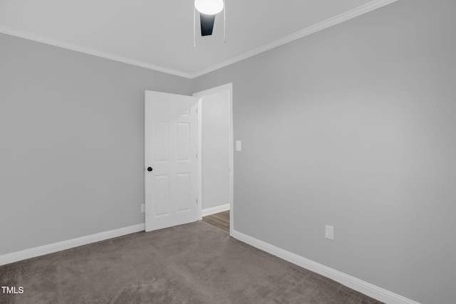 carpeted empty room with crown molding and ceiling fan