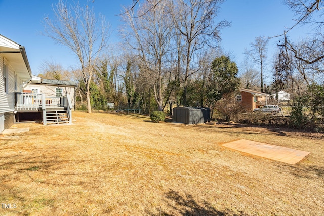 view of yard featuring a wooden deck