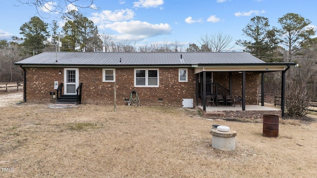 rear view of house featuring a patio area