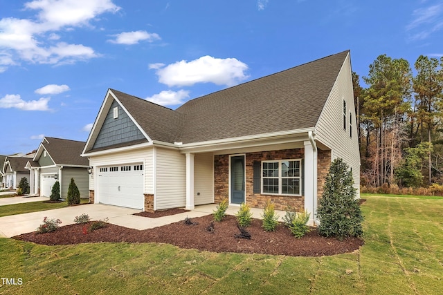 view of front of house with a garage, a porch, and a front lawn