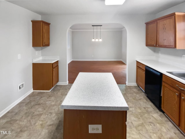 kitchen featuring decorative light fixtures and dishwasher