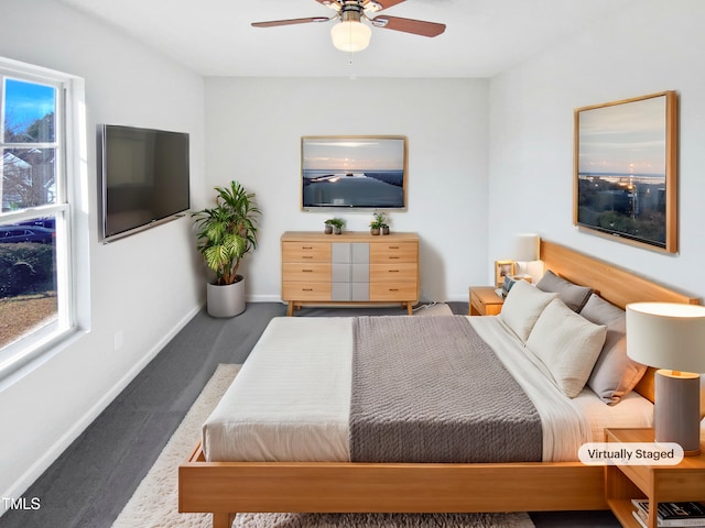 carpeted bedroom featuring ceiling fan