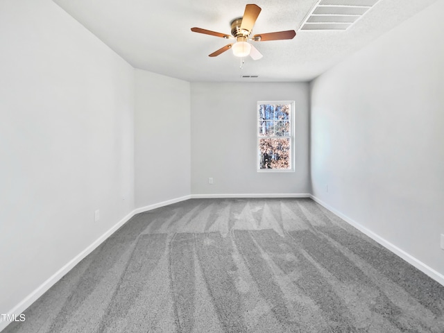 carpeted empty room with ceiling fan