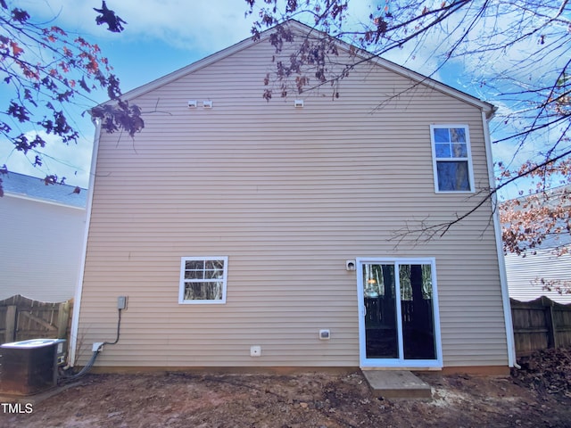 back of property featuring cooling unit