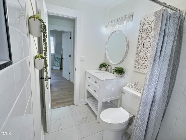 bathroom featuring vanity and toilet