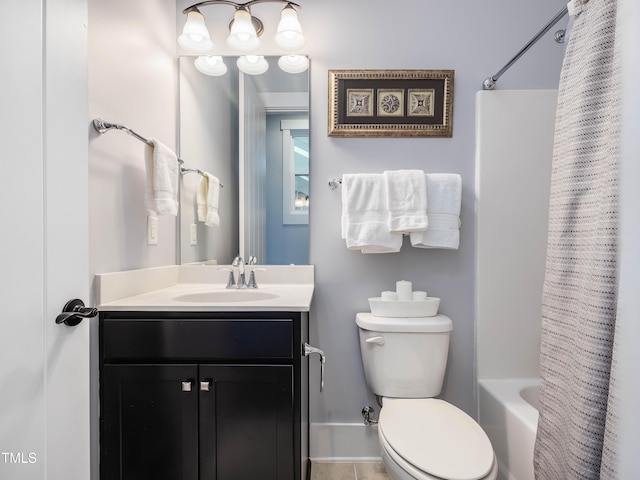 bathroom featuring toilet, shower / tub combo with curtain, and vanity