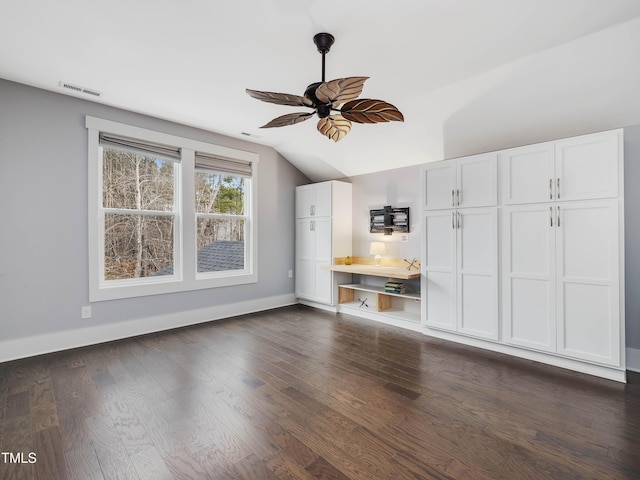 unfurnished living room featuring visible vents, dark wood-type flooring, ceiling fan, baseboards, and lofted ceiling