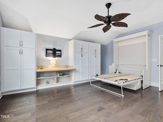 bedroom with dark wood finished floors, lofted ceiling, and a ceiling fan