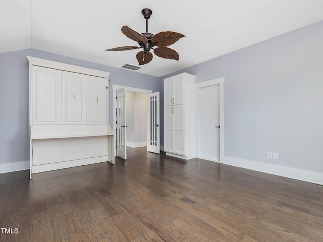 unfurnished bedroom featuring visible vents, baseboards, and wood finished floors