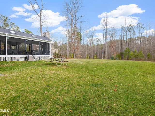 view of yard with a sunroom