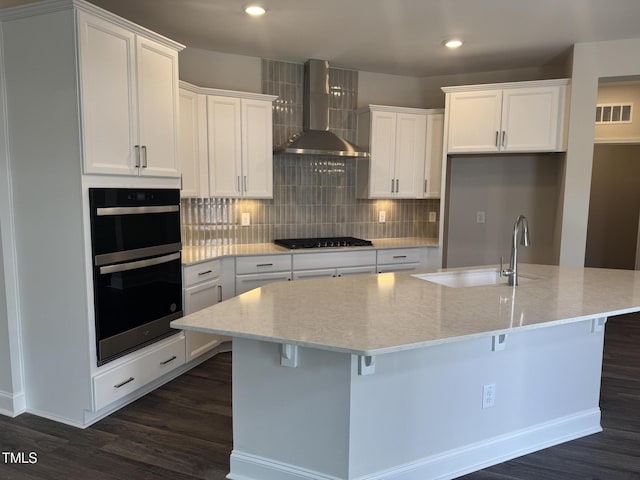 1315 Richfield Oaks Dr, Home, Fuquay Varina, NC 27526 - kitchen with white cabinetry, a kitchen island with sink, and wall chimney range hood