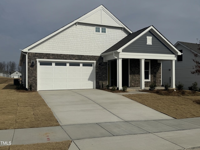 view of front of property with a garage and covered porch