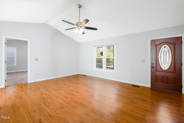 entrance foyer featuring wood-type flooring, lofted ceiling, and ceiling fan