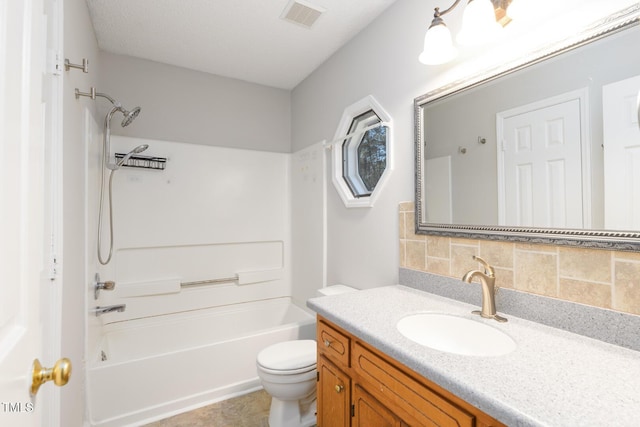 full bathroom featuring vanity, bathtub / shower combination, toilet, and decorative backsplash