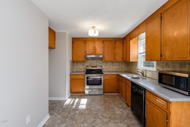 kitchen featuring stainless steel appliances, sink, and decorative backsplash