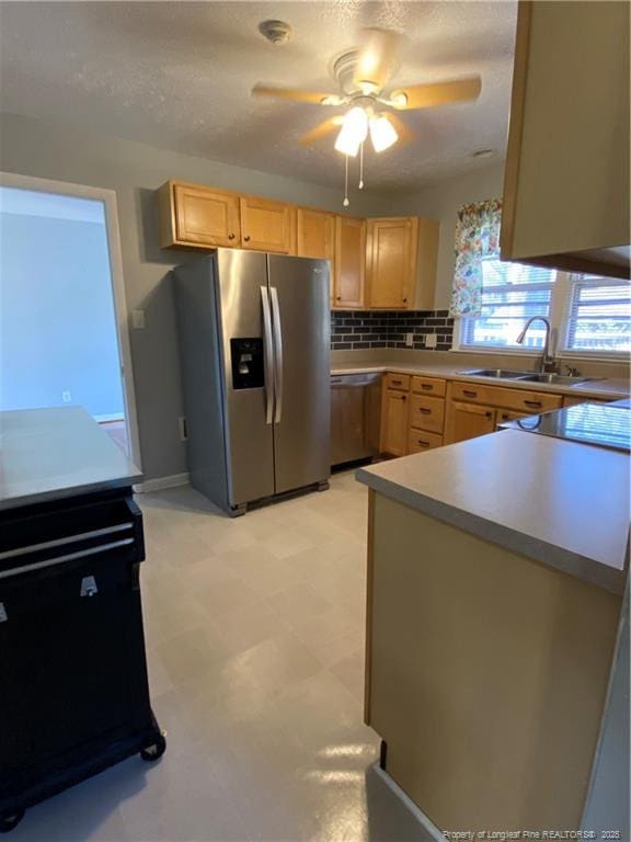 700 W 20th St W, Lumberton, NC 28358 - kitchen with a sink, light floors, light brown cabinetry, and stainless steel appliances