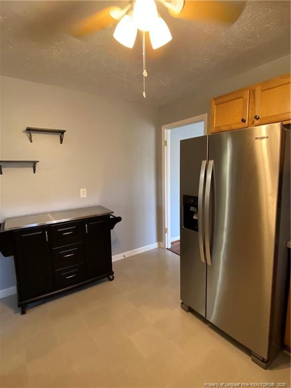 700 W 20th St W, Lumberton, NC 28358 - kitchen featuring a textured ceiling, stainless steel fridge, baseboards, light floors, and ceiling fan