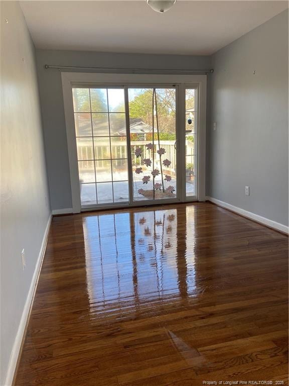 700 W 20th St W, Lumberton, NC 28358 - spare room with baseboards and wood finished floors