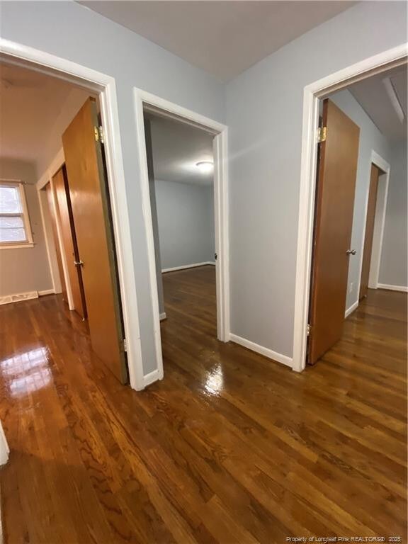 700 W 20th St W, Lumberton, NC 28358 - hallway featuring baseboards and wood finished floors