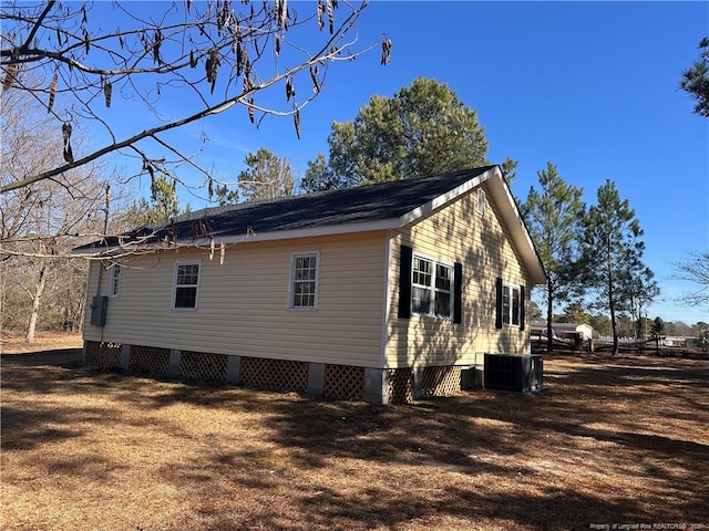 view of side of home with cooling unit