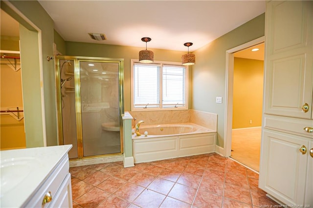 bathroom featuring vanity, shower with separate bathtub, and tile patterned flooring