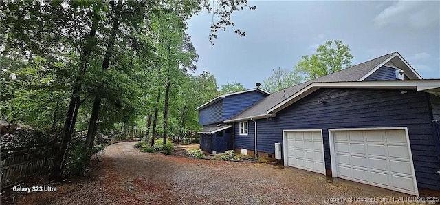 view of property exterior featuring a garage