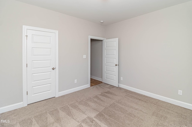 unfurnished bedroom featuring carpet