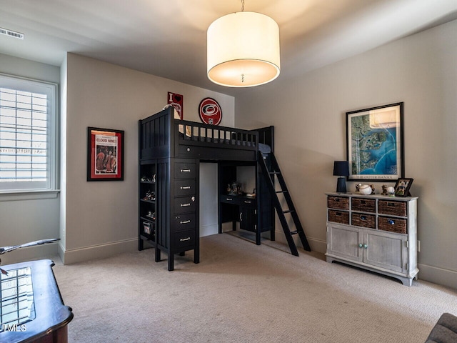 bedroom featuring baseboards, visible vents, and carpet flooring