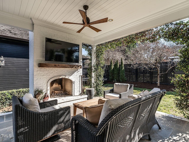 view of patio / terrace featuring an outdoor living space with a fireplace and ceiling fan