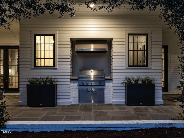 view of patio featuring exterior kitchen and grilling area