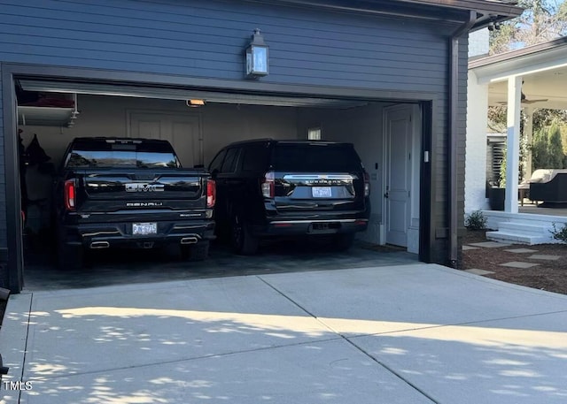 garage with concrete driveway