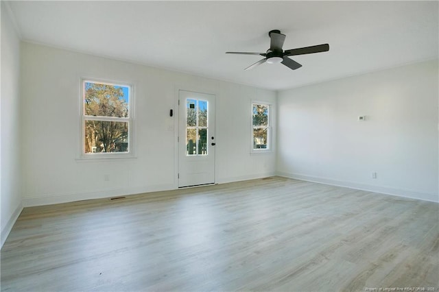 unfurnished room with ceiling fan and light wood-type flooring