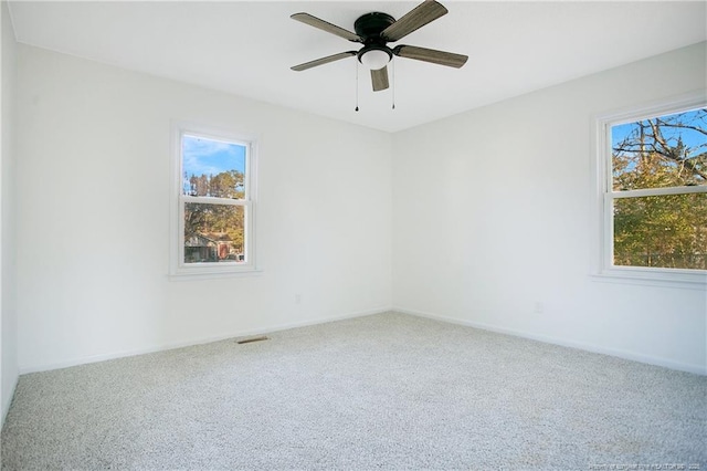 carpeted empty room with ceiling fan