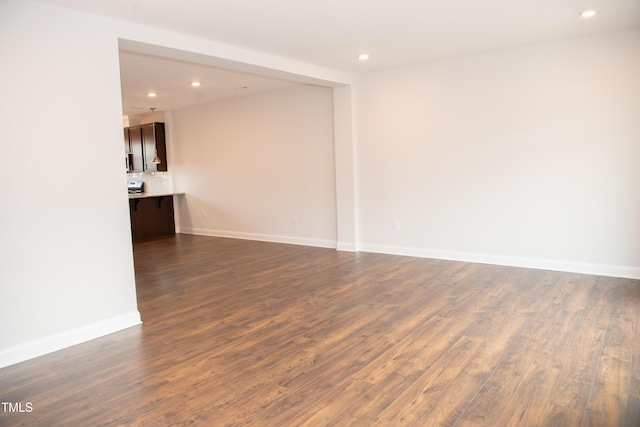 spare room featuring dark hardwood / wood-style floors