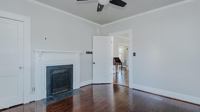 unfurnished living room featuring wood-type flooring, baseboards, crown molding, and a fireplace with flush hearth