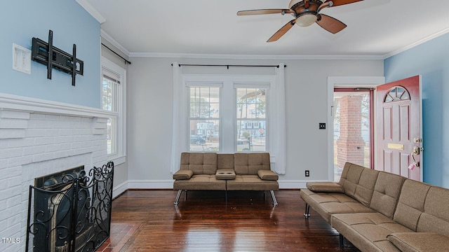 living room with baseboards, ornamental molding, a wealth of natural light, and wood finished floors