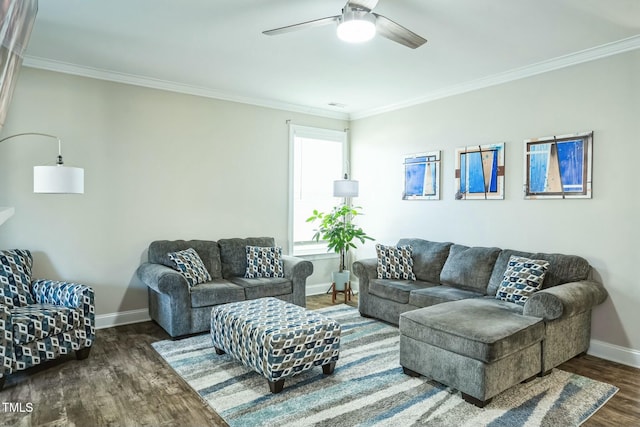 living room featuring crown molding, dark wood-type flooring, and ceiling fan