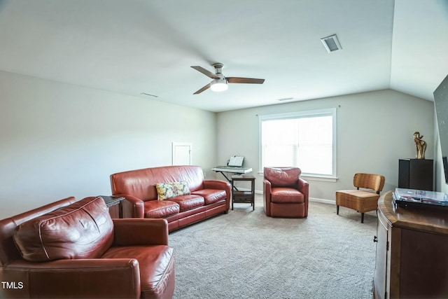 carpeted living room featuring ceiling fan and vaulted ceiling