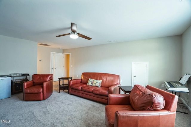 living room featuring carpet floors and ceiling fan