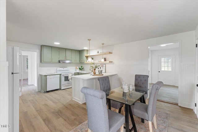 dining space with light hardwood / wood-style floors