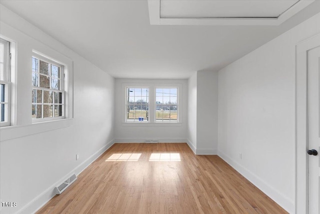 spare room with light wood-type flooring