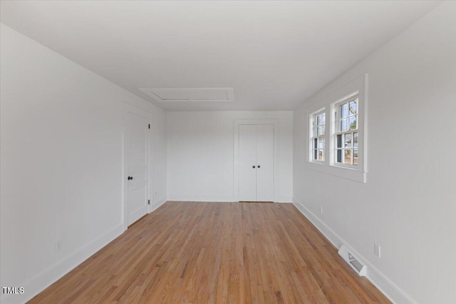 spare room with light wood-type flooring