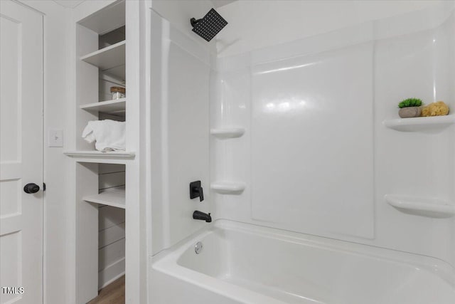 bathroom with shower / washtub combination