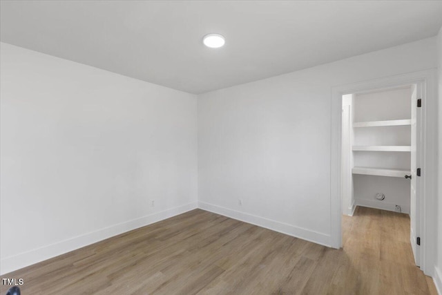 unfurnished room with light hardwood / wood-style floors