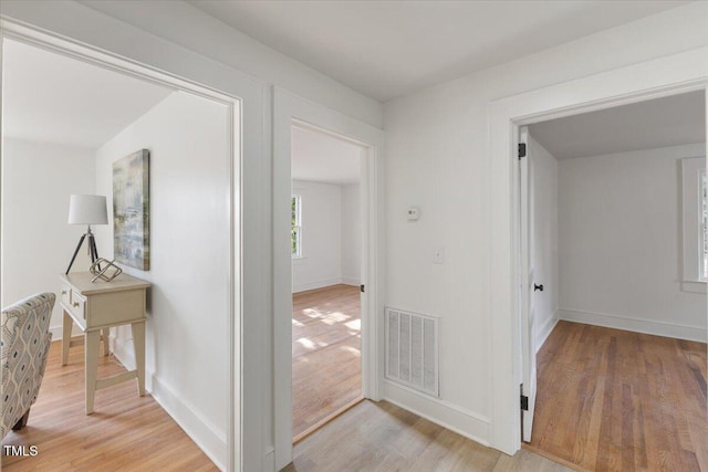 corridor featuring light hardwood / wood-style floors