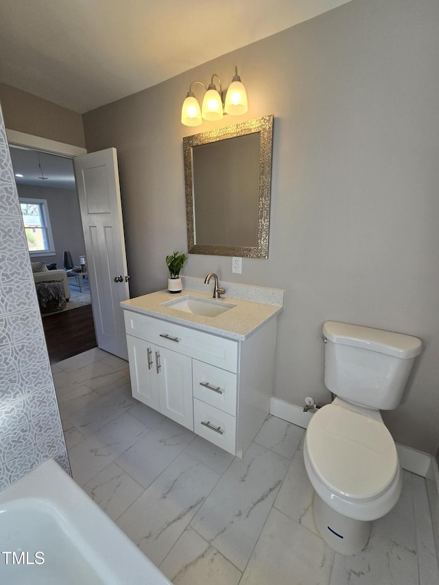 bathroom featuring vanity and toilet