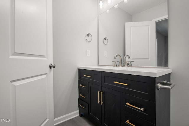 bathroom featuring hardwood / wood-style flooring and vanity